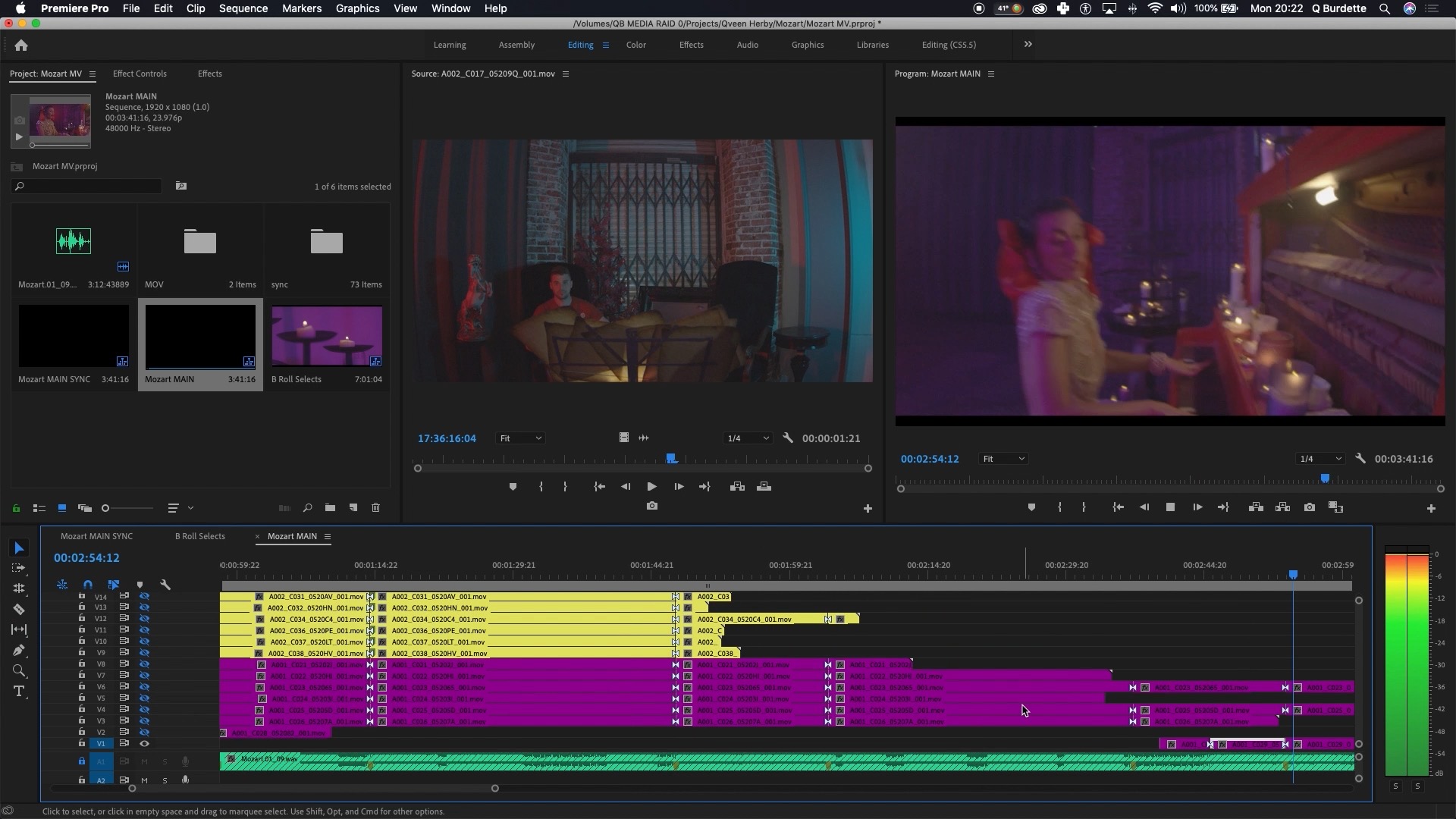 Q editing footage on a laptop