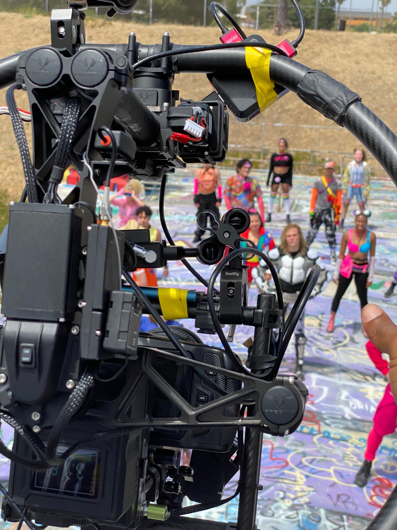 Q operating a Movi rig on a graffiti-covered location